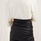 Chels Ruched Vegan Leather Mini Skirt in Black Nazli Ceren 