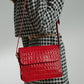 Square shoulder bag with printed red leather flap